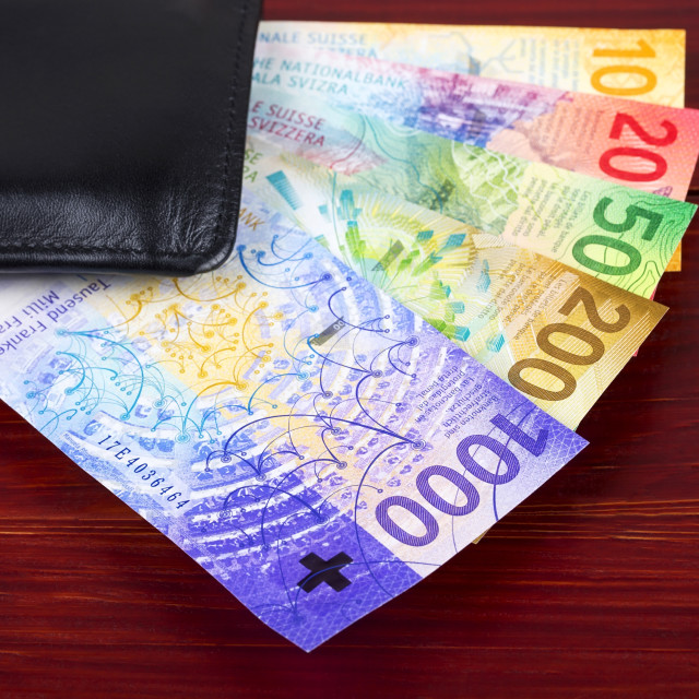 "New Swiss Francs in the black wallet" stock image