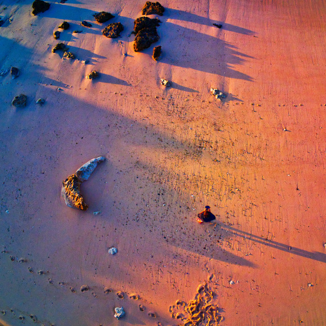 "AERIAL VIEW OF A MEN ALONE ON THE BEACH" stock image