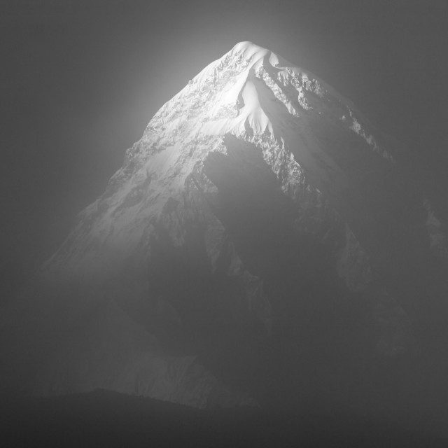 "Pumori covered with a thin cloud. A late afternoon view in B&W." stock image