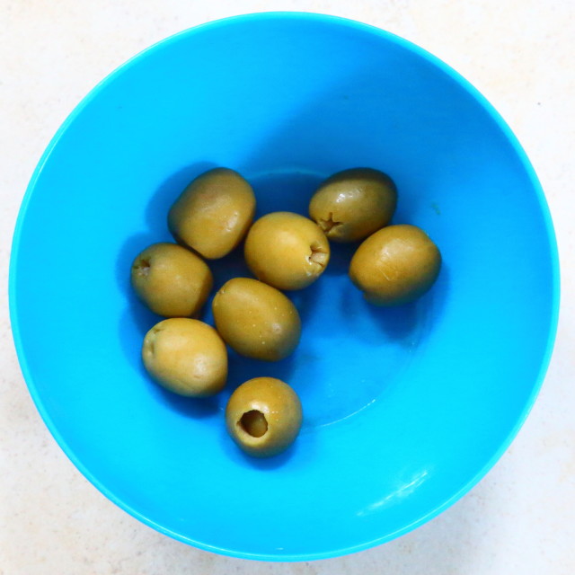 "Olives in blue bowl" stock image