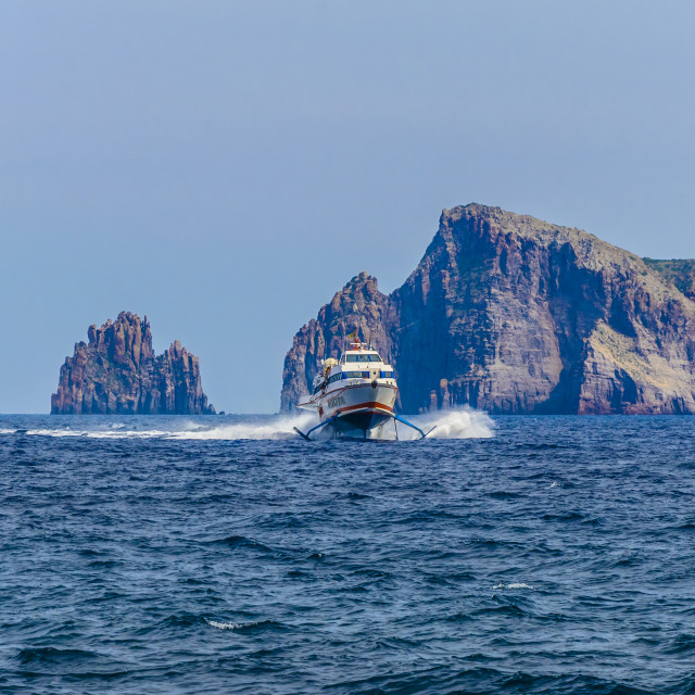 "Ferry sailing between two great cliffs" stock image
