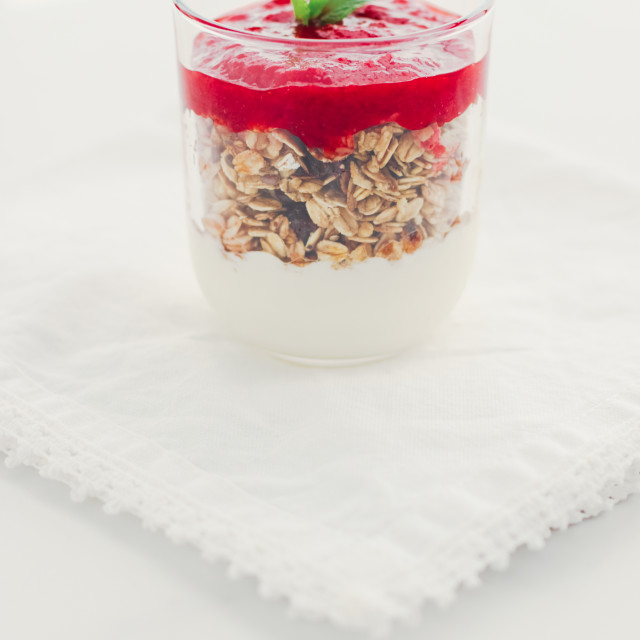 "Homemade granola parfait with strawberry jam and mint, yogurt and muesli for..." stock image
