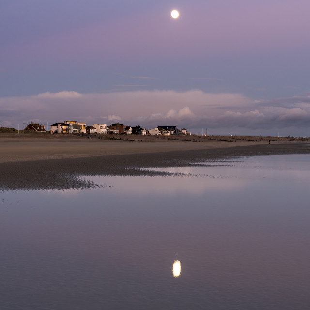 "Moonrise, Camber Sands, East Sussex, England." stock image