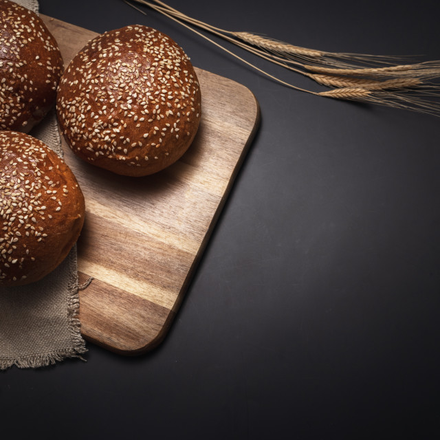 "Homemade sourdough bread. Burger bun isolated on wooden backgrou" stock image