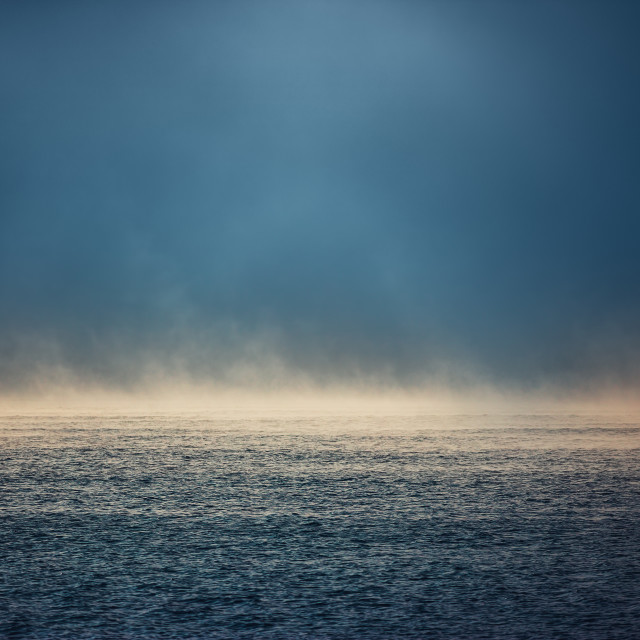 "Sea sunrise and foggy morning. Fog above blue ripple water, aeri" stock image