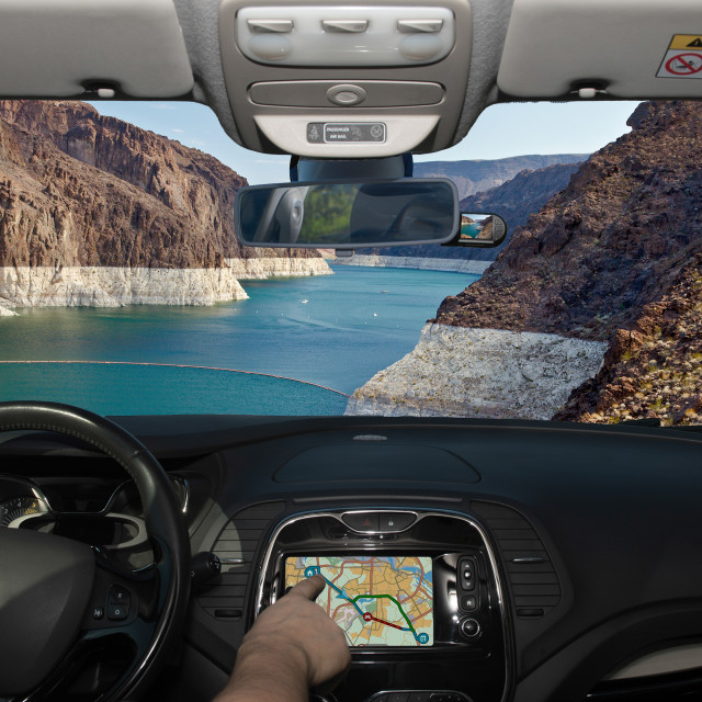 "Driving using GPS with view of Colorado river, Nevada, USA" stock image