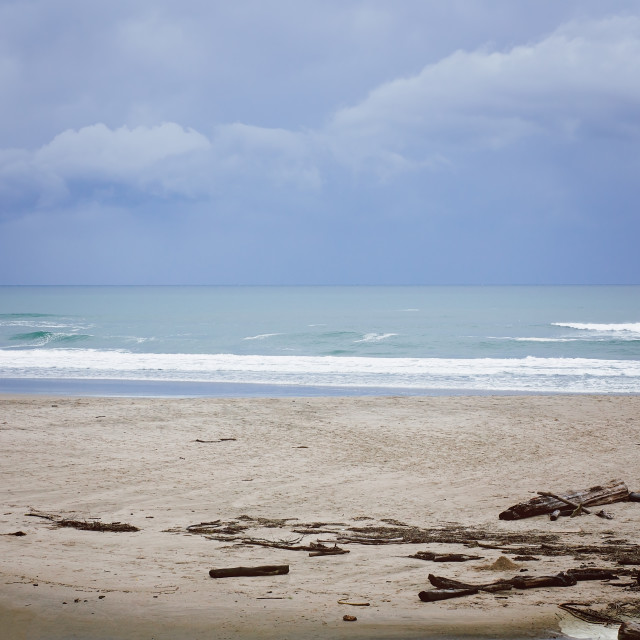 "Dramatic Clouds, With Waves Rolling in on a Sandy Beach in Northern California" stock image