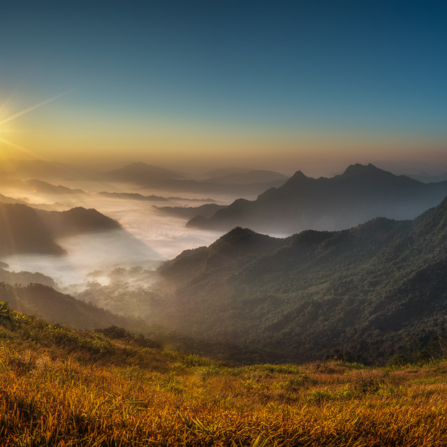 "Phu Chi Fa Sunrise, Thailand" by Andrew Gray Photography - £25.00 "Phu Chi Fa Sunrise, Thailand" stock image