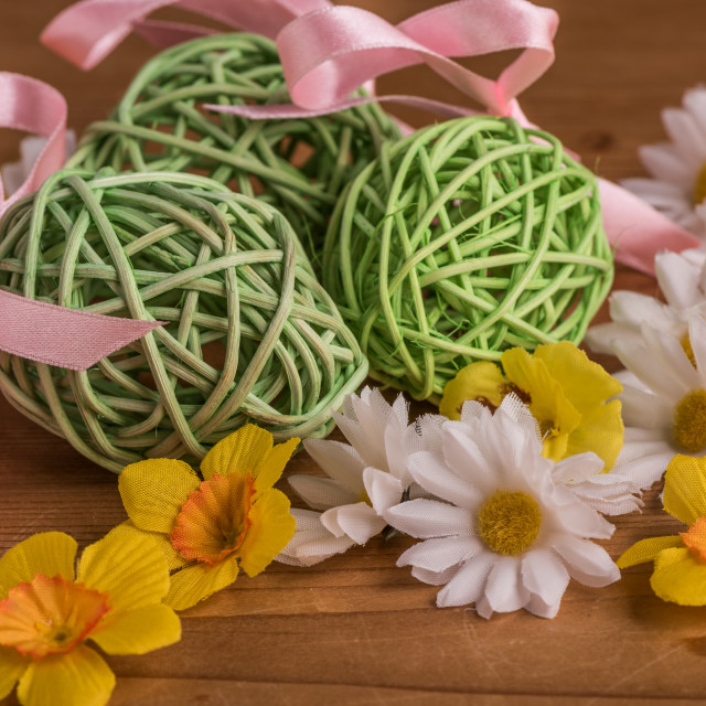 "Green woven eater eggs in white and yellow flower" stock image