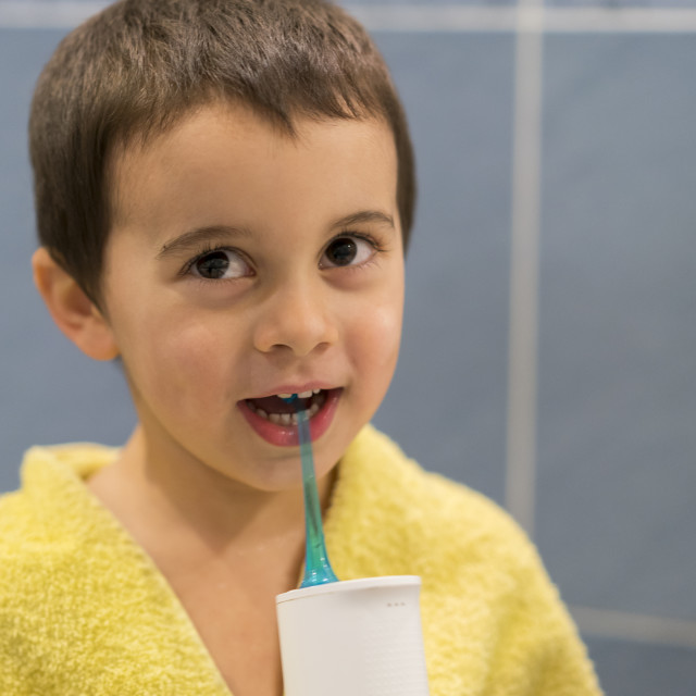 a-5-year-old-boy-at-home-washes-his-teeth-with-an-oral-irrigator