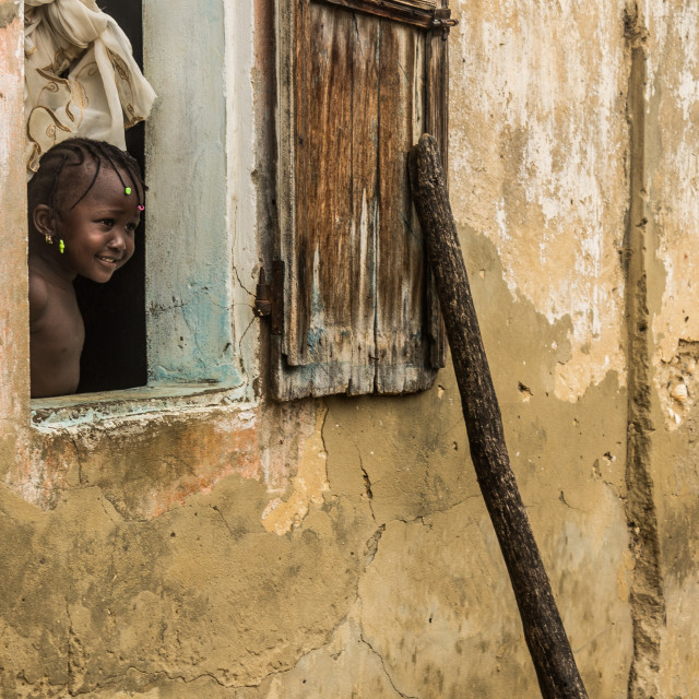 "Girl looking out the window" stock image