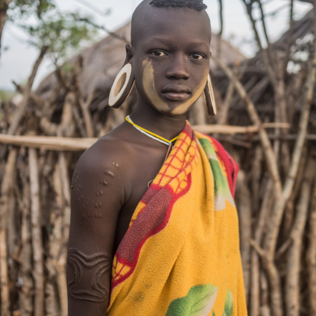 "Young Mursi Woman" by Anibal Bueno - $12.20 "Young Mursi Woman" stock image
