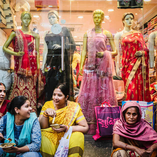 "Indian ladies sat in front of sari shop" stock image