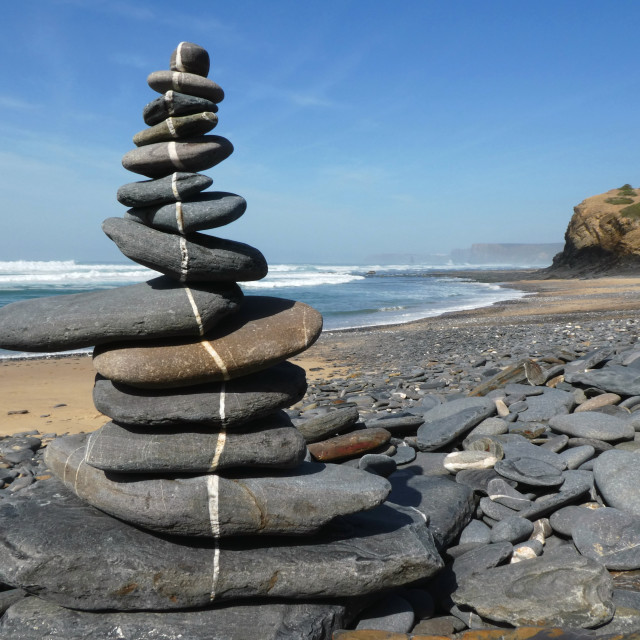 "beach stone balance along a line" stock image