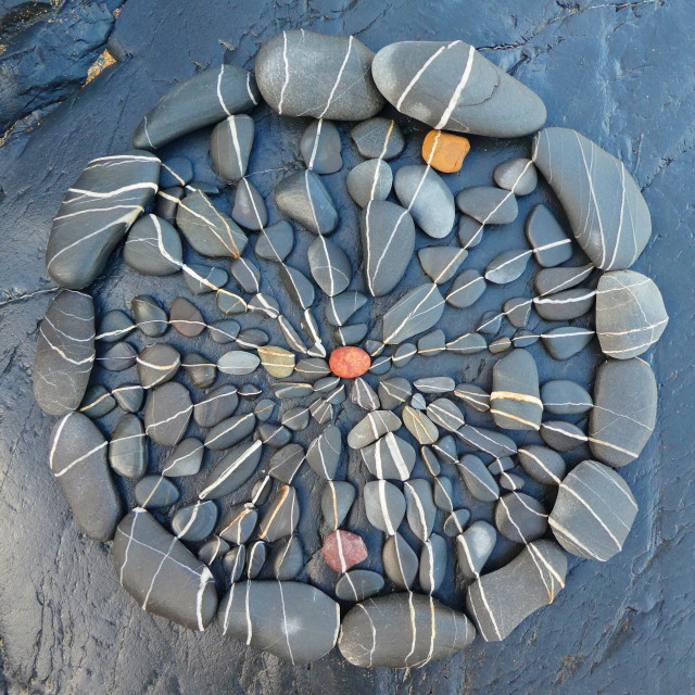 "circle mandala from beach pebbles" stock image