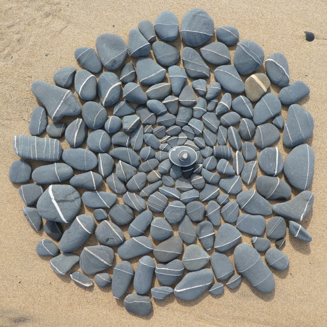 "stone circles from beach pebbles" stock image