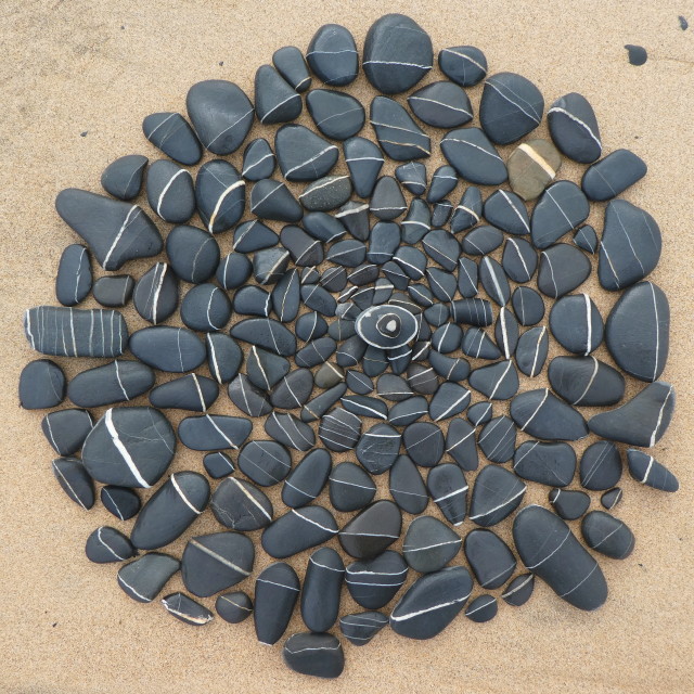 "stone circles from beach pebbles" stock image