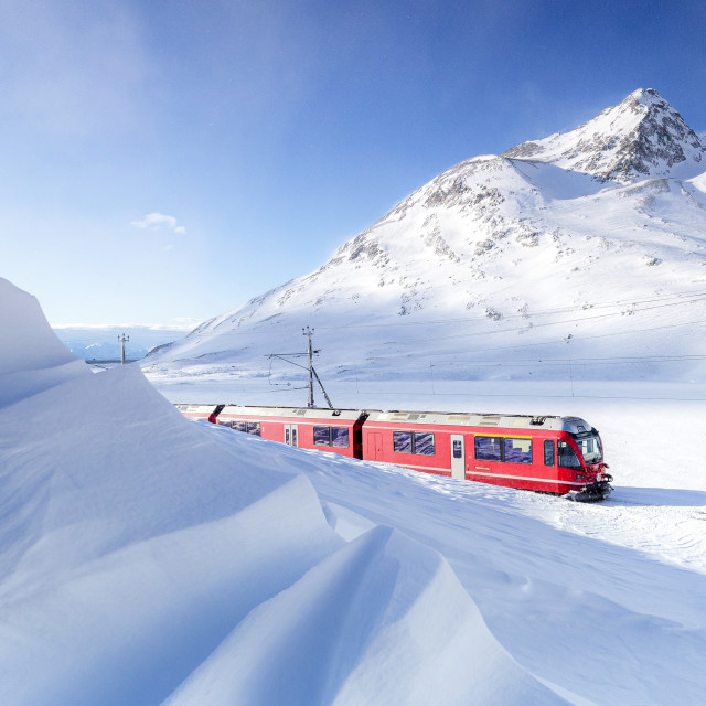 "Bernina Express transit along Lago Bianco during winter blizzard ,Bernina..." stock image