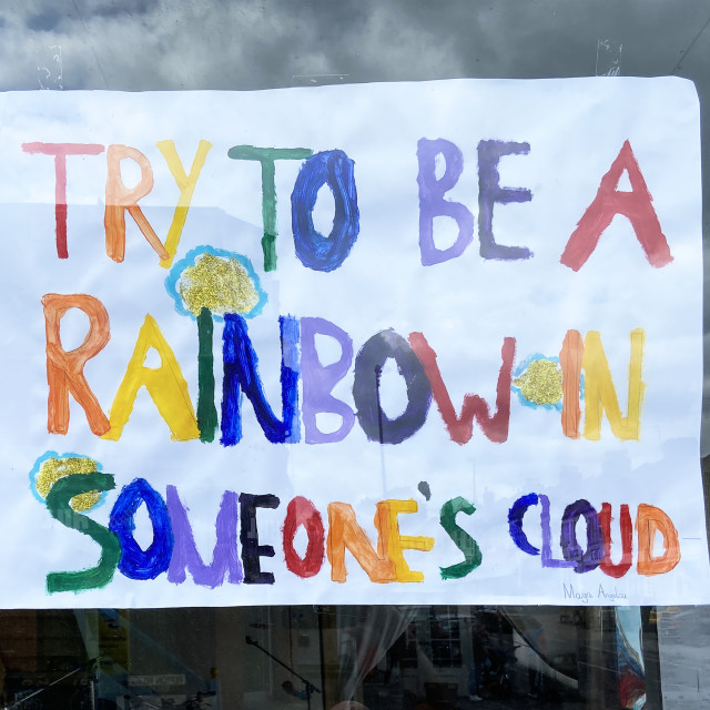 "Try to be a rainbow in someone's cloud" stock image