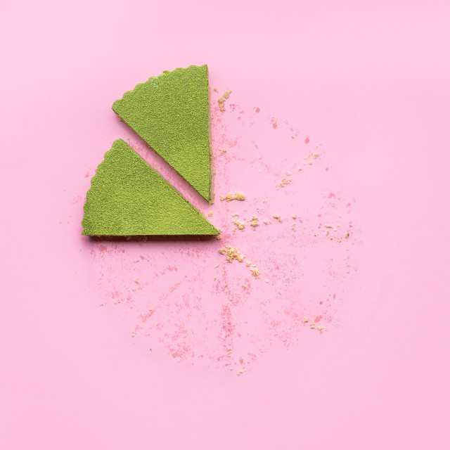 "Slices of green matcha cheesecake on pink background" stock image