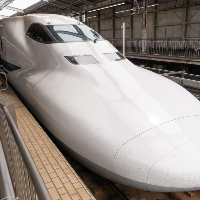 "japanese bullet train parked at a station" stock image