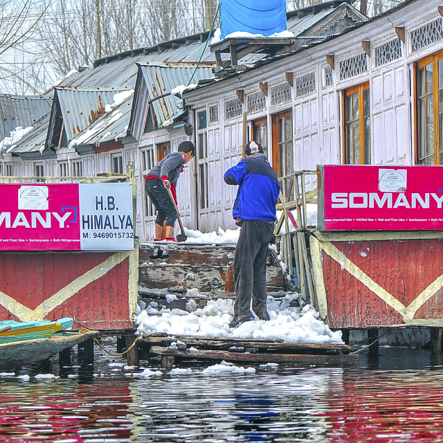 "Snow Removal at a House Boat at Dal Lake, Srinagar" stock image