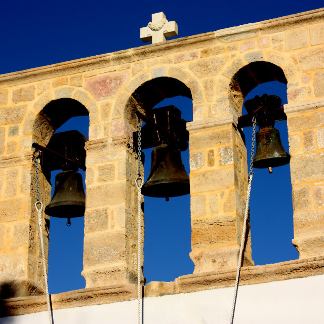 "Three bells on a church in Skala on Patmos" by Julian Worker - £7.50 "Three bells on a church in Skala on Patmos" stock image