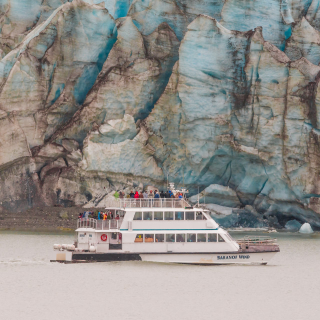 "Alaska tour boat by a glacier" stock image