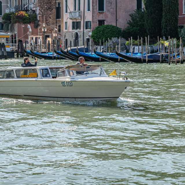 "Water Taxi - Venice with tourist taking photographs" stock image