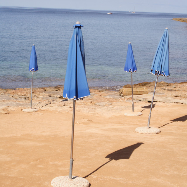 "Closed beach parasols, Ibiza, Balearic Islands, Spain" by Rob Jones - $12.27 "Closed beach parasols, Ibiza, Balearic Islands, Spain" stock image