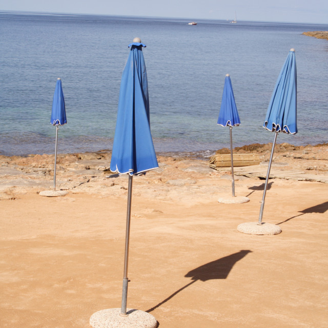 "Closed beach parasols, Ibiza, Balearic Islands, Spain" stock image