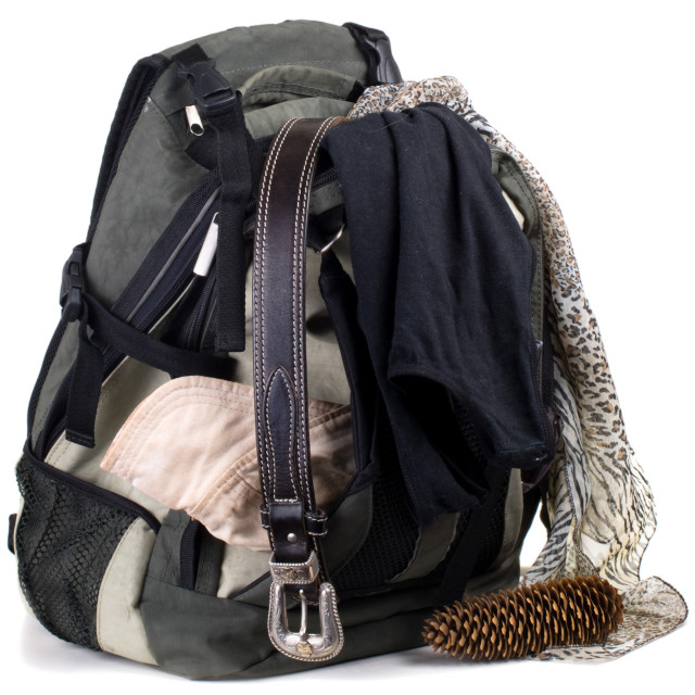 "Backpack with clothes isolated on white background" stock image