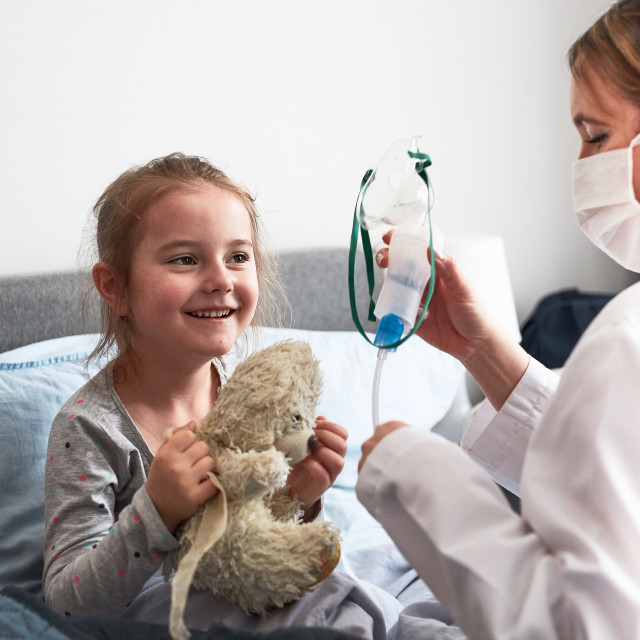 "Child having medical inhalation treatment with nebuliser" stock image