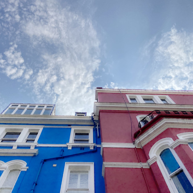 "Brightly painted townhouses" stock image