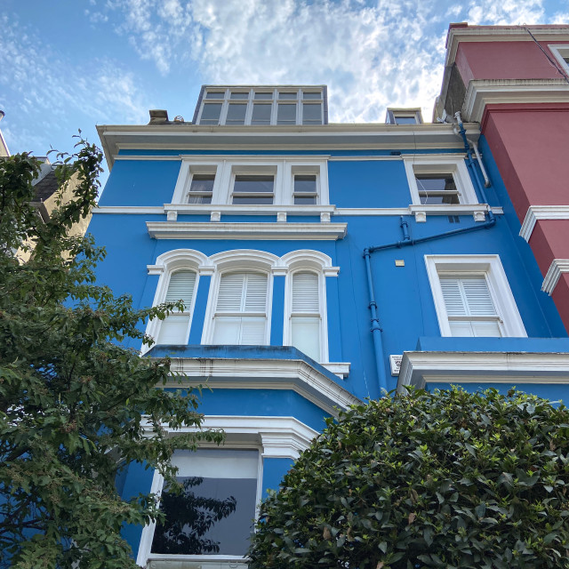 "Brightly painted townhouses" stock image