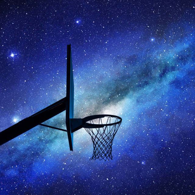 "Basketball hoop silhouette at night" stock image