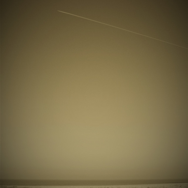 "Sky with Vapour Trail, Cley, Norfolk" stock image