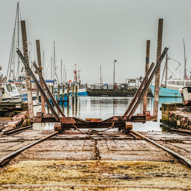 "An industrial rail boat ramp or boat deployer on platform in a f" stock image