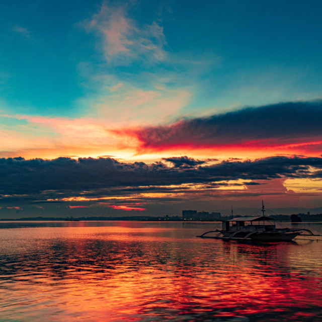 "Clouds On Fire As The Sun Sets Over Pacific Resort - Cebu, Philippines, Asia" by Lewis Fink - £10.00 "Clouds On Fire As The Sun Sets Over Pacific Resort - Cebu, Philippines, Asia" stock image