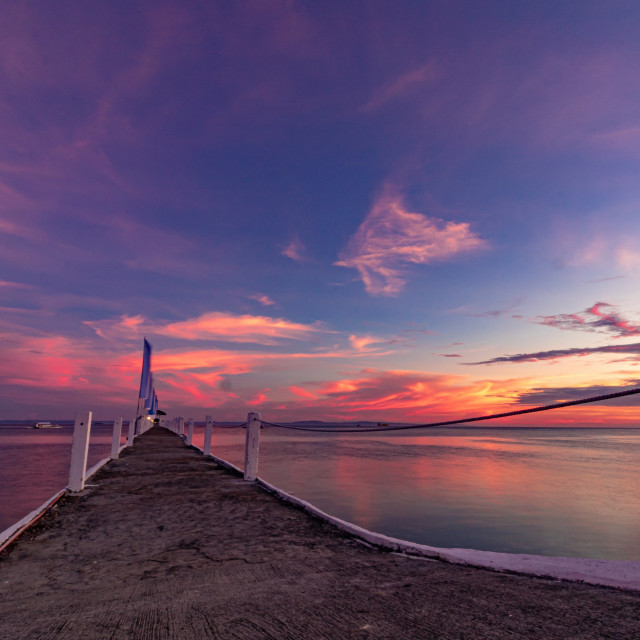 "The Summer Sun Sets Over The Pier At Pacific Resort - Cebu, Philippines, Asia" by Lewis Fink - £10.00 "The Summer Sun Sets Over The Pier At Pacific Resort - Cebu, Philippines, Asia" stock image