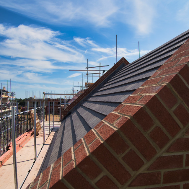 "Completed roof on building site" stock image