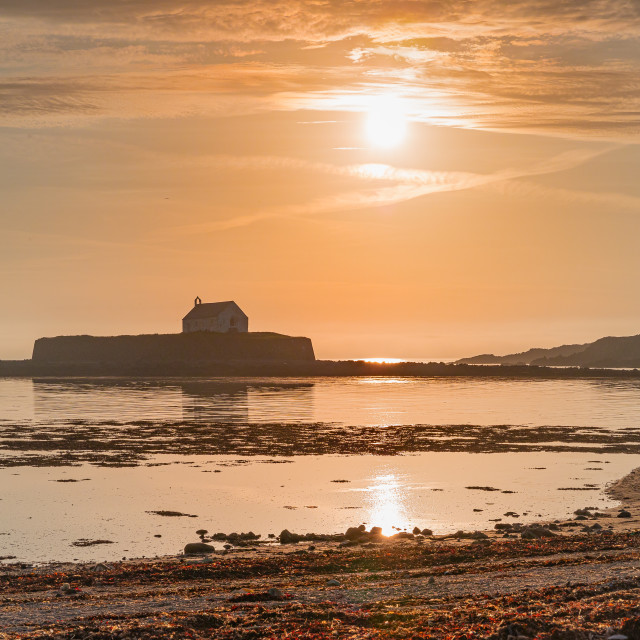 "Church of St. Cwyfan at sunset" stock image