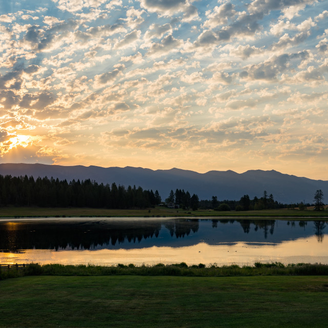 "Sunset Over a Lake in Whitefish Montana" by Justin Mueller - £10.00 "Sunset Over a Lake in Whitefish Montana" stock image