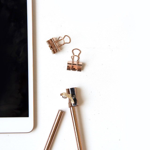 "Flatlay with ipad and rose gold stationary" stock image