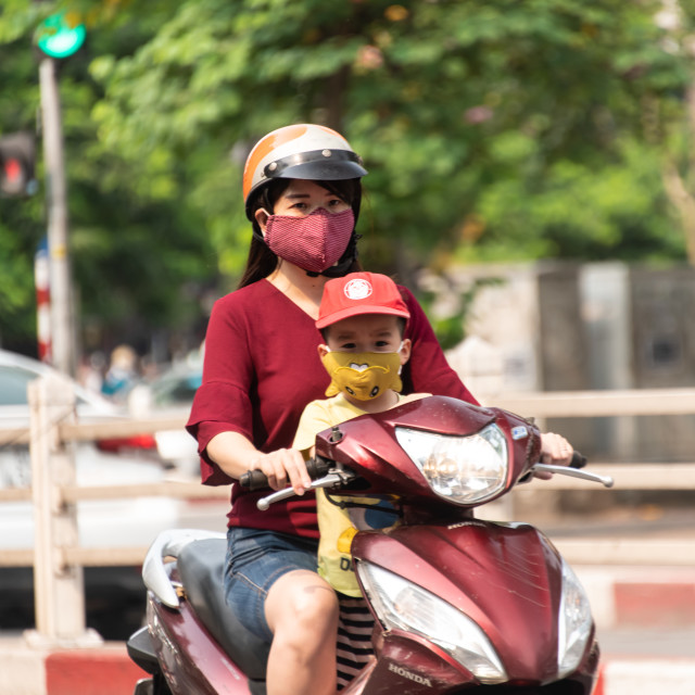"People in Vietnam wearing facemasks against the air pollution and covid19" by frederik enneman - £20.00 "People in Vietnam wearing facemasks against the air pollution and covid19" stock image