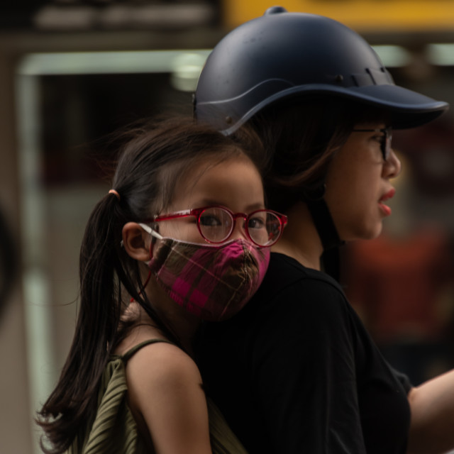 "People in Vietnam wearing facemasks against the air pollution and covid19" by frederik enneman - £20.00 "People in Vietnam wearing facemasks against the air pollution and covid19" stock image