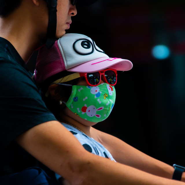 "People in Vietnam wearing facemasks against the air pollution and covid19" by frederik enneman - £20.00 "People in Vietnam wearing facemasks against the air pollution and covid19" stock image