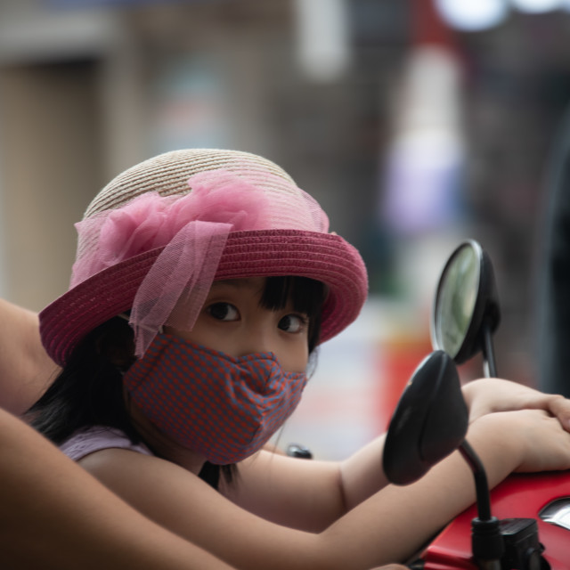 "People in Vietnam wearing facemasks against the air pollution and covid19" by frederik enneman - £20.00 "People in Vietnam wearing facemasks against the air pollution and covid19" stock image