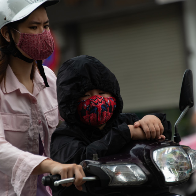 "People in Vietnam wearing facemasks against the air pollution and covid19" by frederik enneman - £20.00 "People in Vietnam wearing facemasks against the air pollution and covid19" stock image