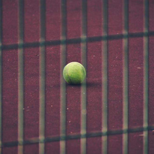 "Tennis ball on the tennis court floor" stock image